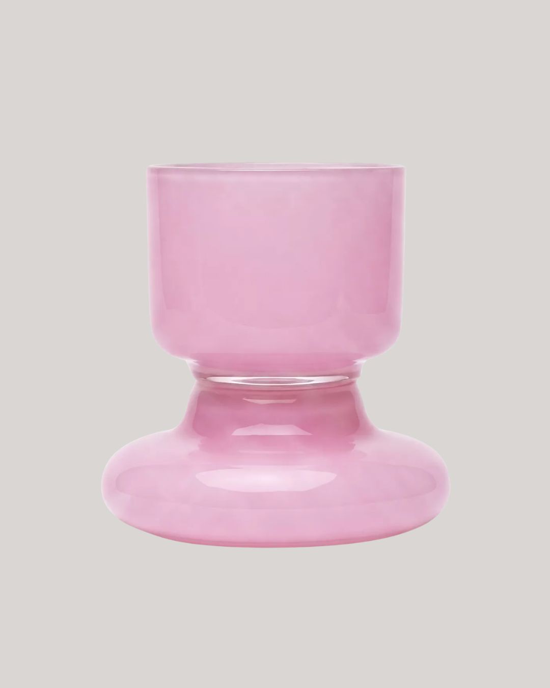 Chunky Water Glass in Pink against beige background.
