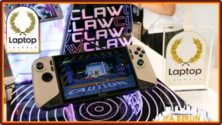 The MSI Claw 8 AI Plus on display at IFA Berlin alongside a Laptop Laurels award trophy