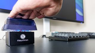 A person using the Keychron Q0 Mini 8K Action Key at their desk