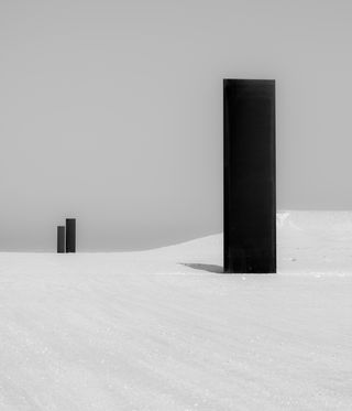 long black columns in desert