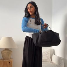 Woman in baseball tee and balloon pants