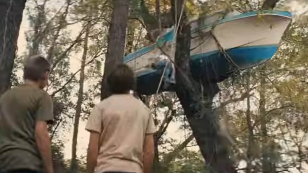 A boat stuck in a tree in Mud