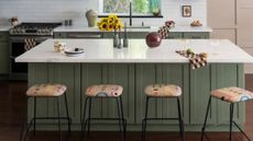 Sage green kitchen island with marble top