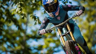 Tahnée Seagrave riding downhill in her new TS57 clothing range