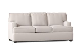 A white queen sleeper sofa with pull out mattress
