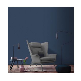 blue wall with grey accent chair