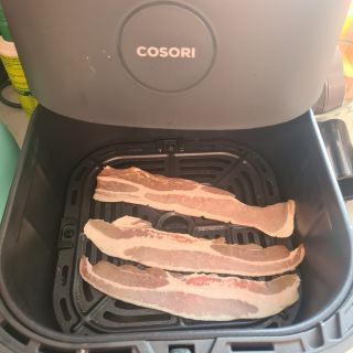 Uncooked bacon in Cosori Air Fryer