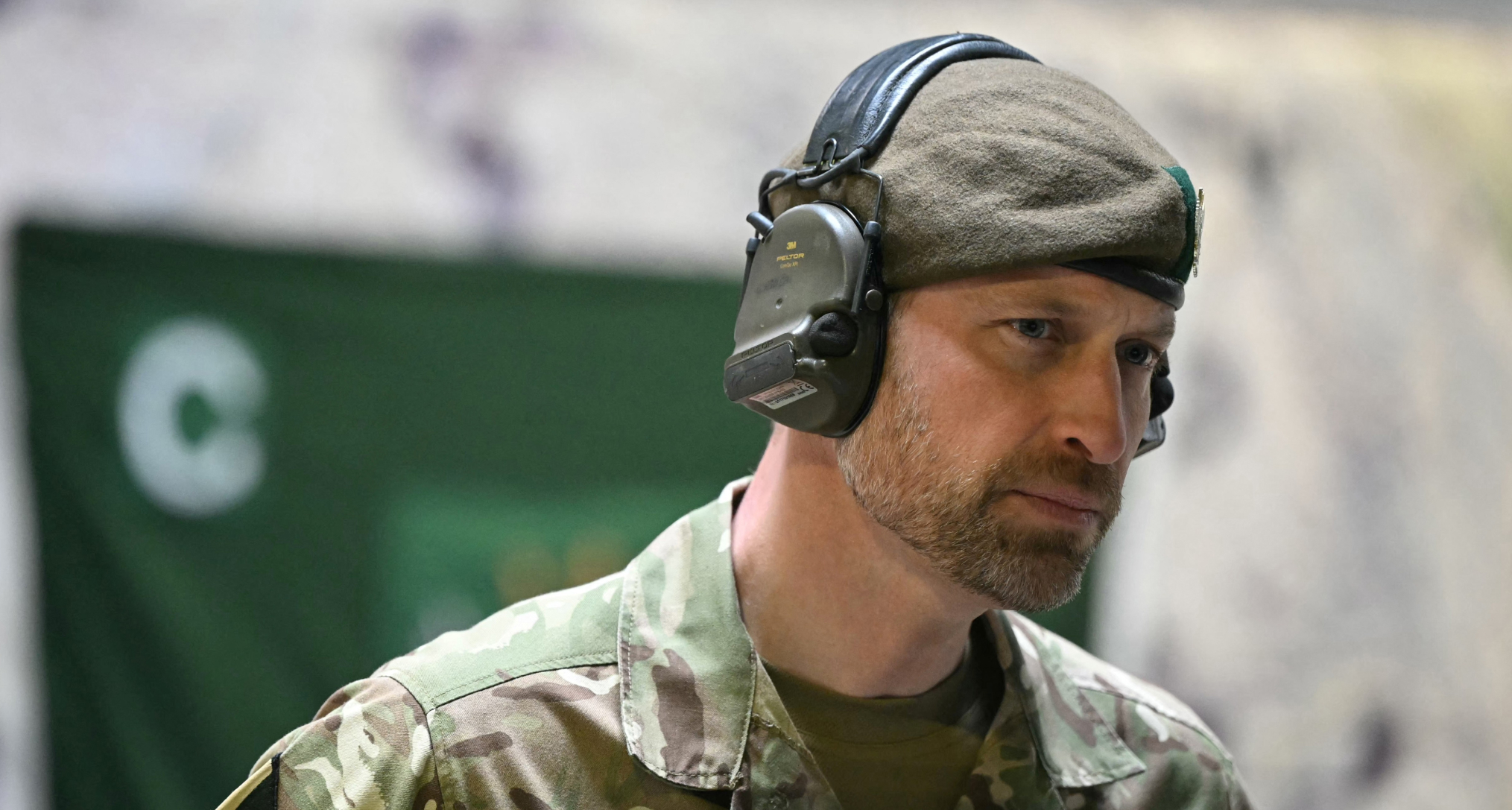 Prince William wearing camo and headphones