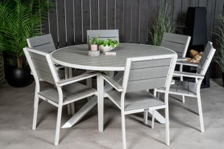 modern six seater dining set in grey on a modern patio