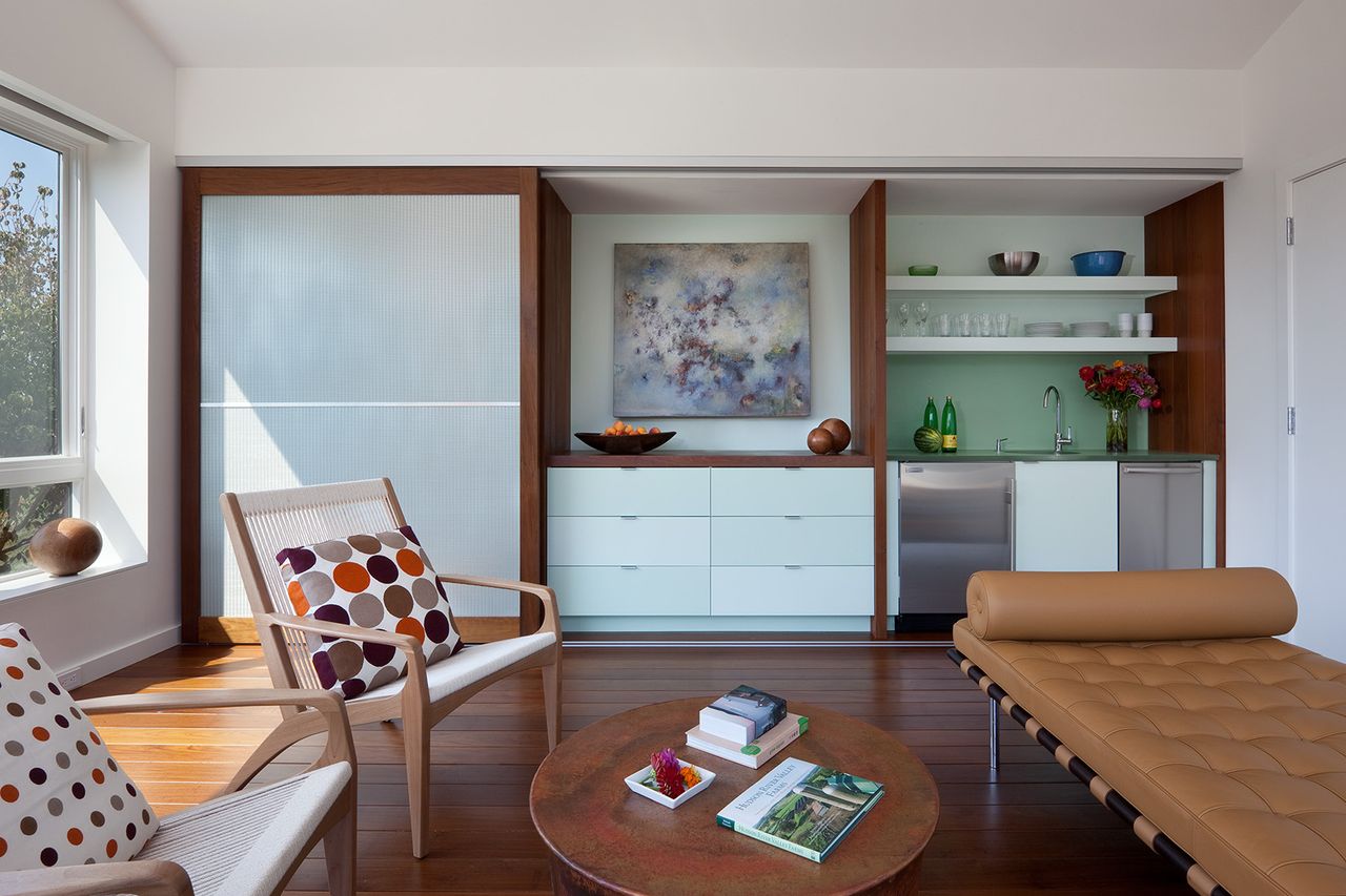 A living room with a hidden storage unit