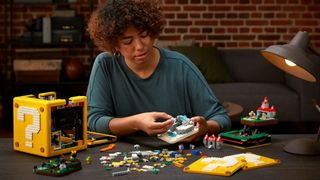 Super Mario Lego - A person building the Lego Super Mario 64 Question Mark Block
