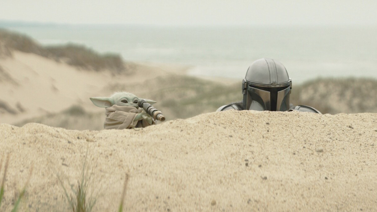 (L-R) Grogu, and Pedro Pascal as The Mandalorian, in "The Mandalorian and Grogu" (2026)