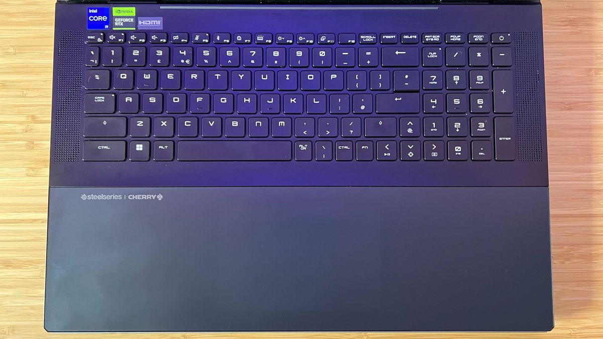 MSI Titan 18 HX keyboard and trackpad without RGB lighting, the trackpad is near invisible against the bottom gray panel