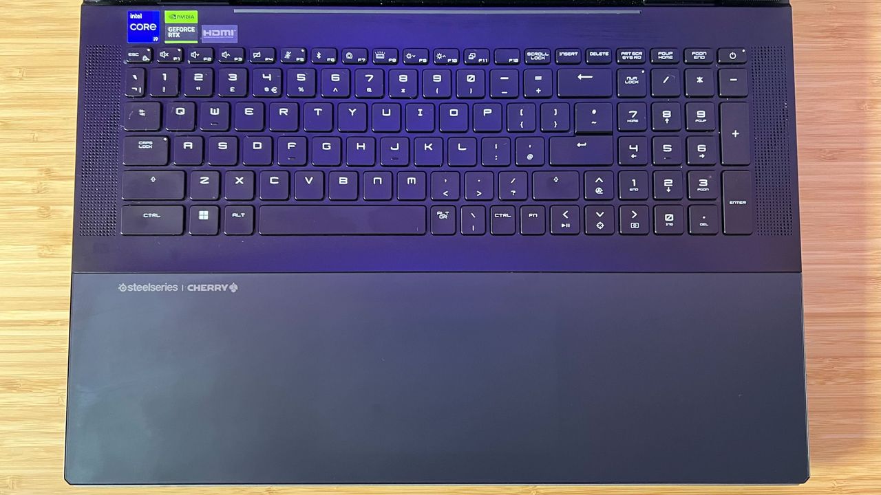 MSI Titan 18 HX keyboard and trackpad without RGB lighting, the trackpad is near invisible against the bottom gray panel