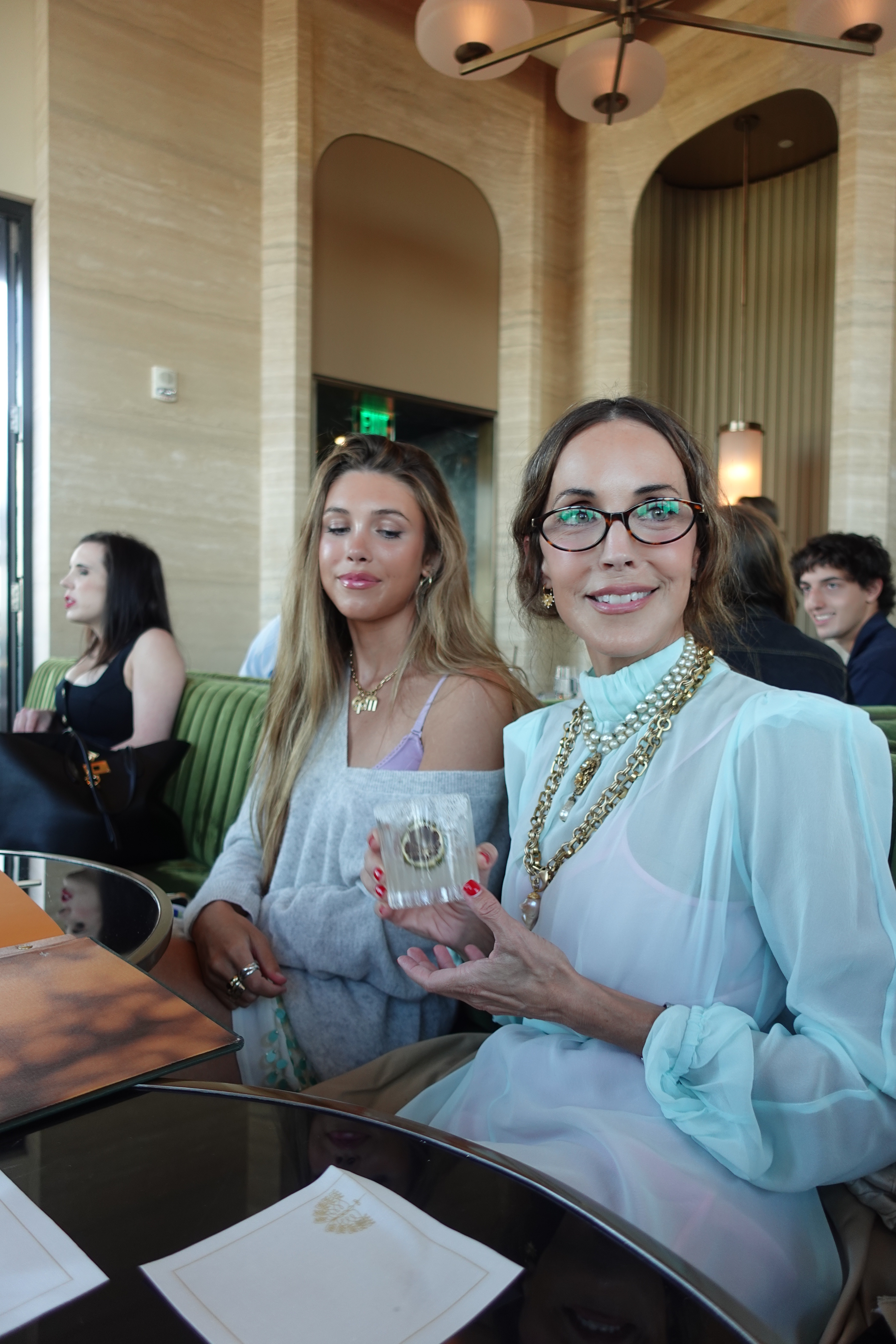a photo of fashion content creator Larissa Mills wearing trendy shoes and glasses