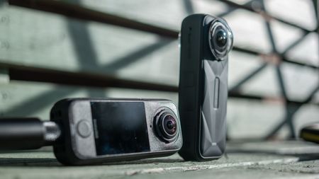 The Insta360 X5 and X4 Air action cameras in an outdoor setting under natural light
