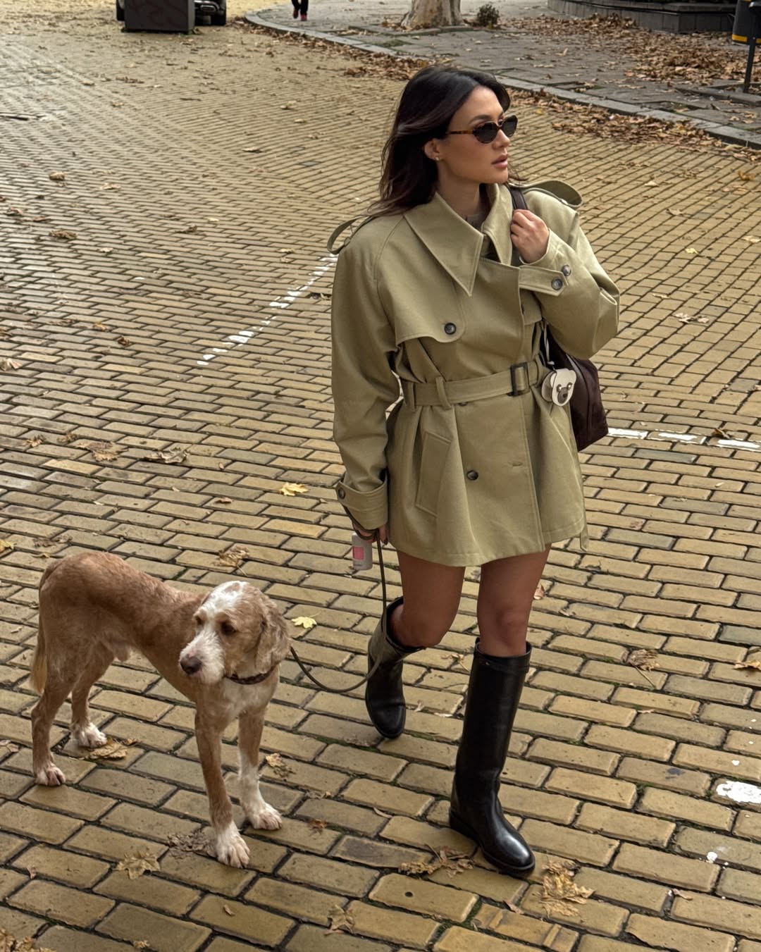 Influencer Borislava Sekova wearing flat knee-high boots.