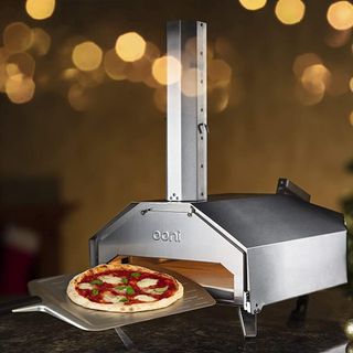 Ooni Pro pizza oven with a freshly cooked pizza