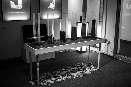 The grass on the table represents life being brought back to the stories in Charlie Jennings degree project