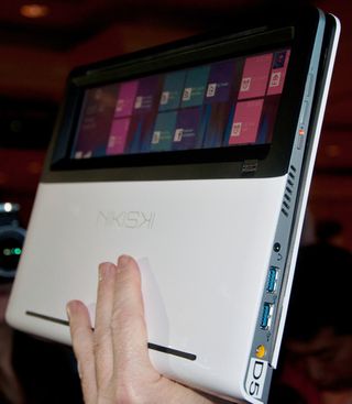 Intel's nikiski see-through notebook has a full-length touch display.