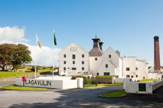 Whisky distillery buildings against blue sky