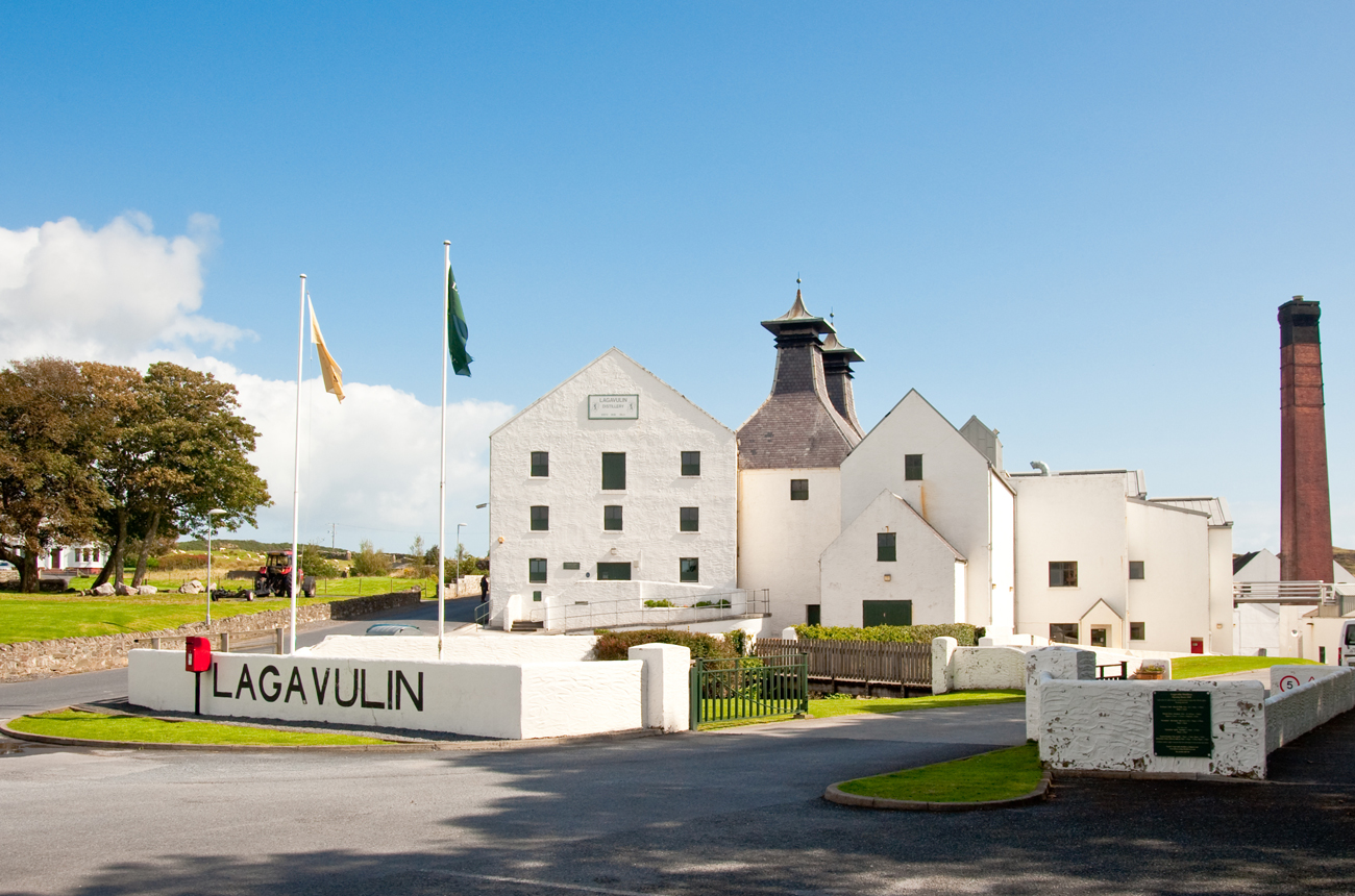 Whisky distillery buildings against blue sky