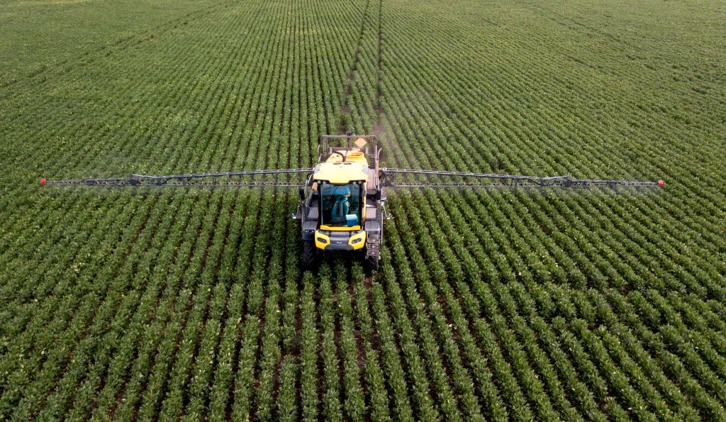 Spraying pesticides.