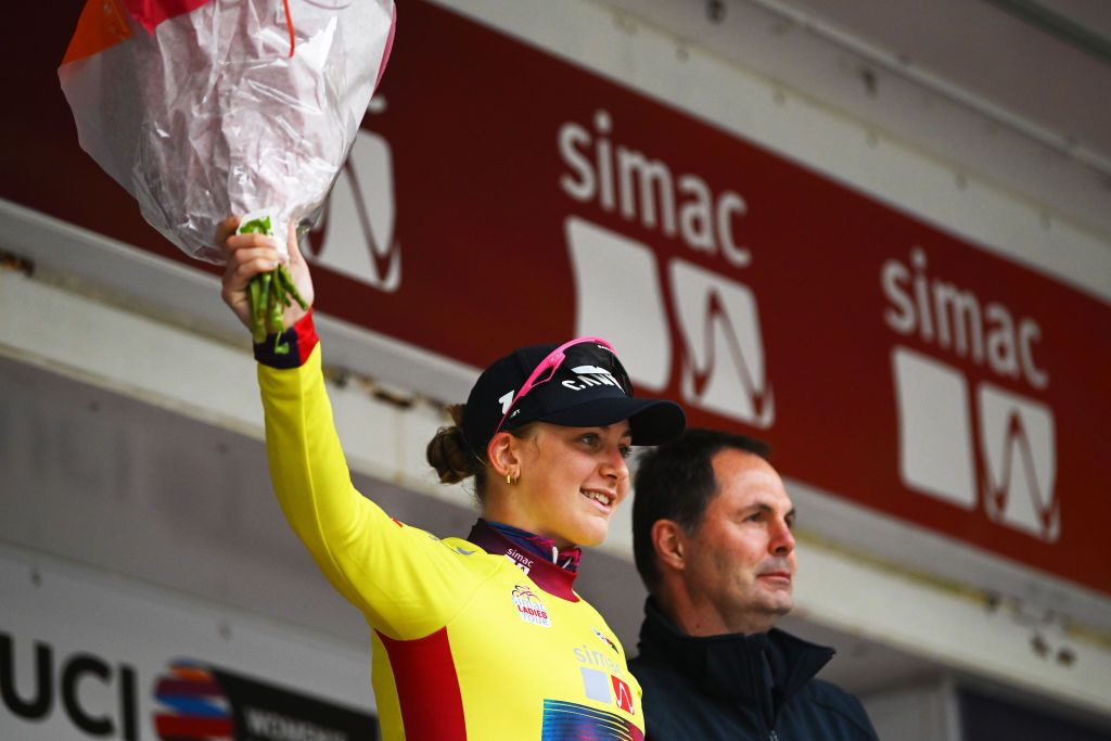 ASSEN NETHERLANDS OCTOBER 09 Zoe Backstedt of The United Kingdom and Team CanyonSRAM Racing celebrates at podium as Yellow leader jersey winner during the 26th Simac Ladies Tour 2024 Stage 2 a 1548km stage from Coevorden to Assen on October 09 2024 in Assen Netherlands Photo by Luc ClaessenGetty Images