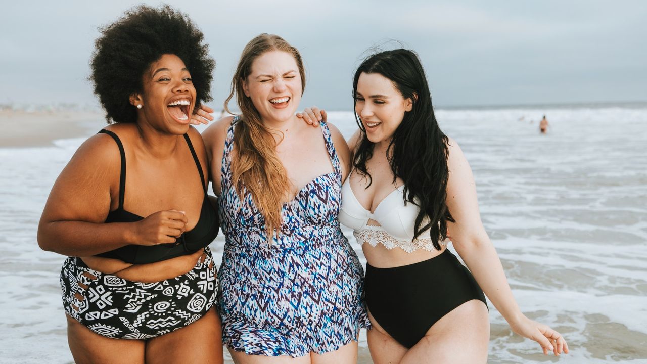 women laughing in swimsuits