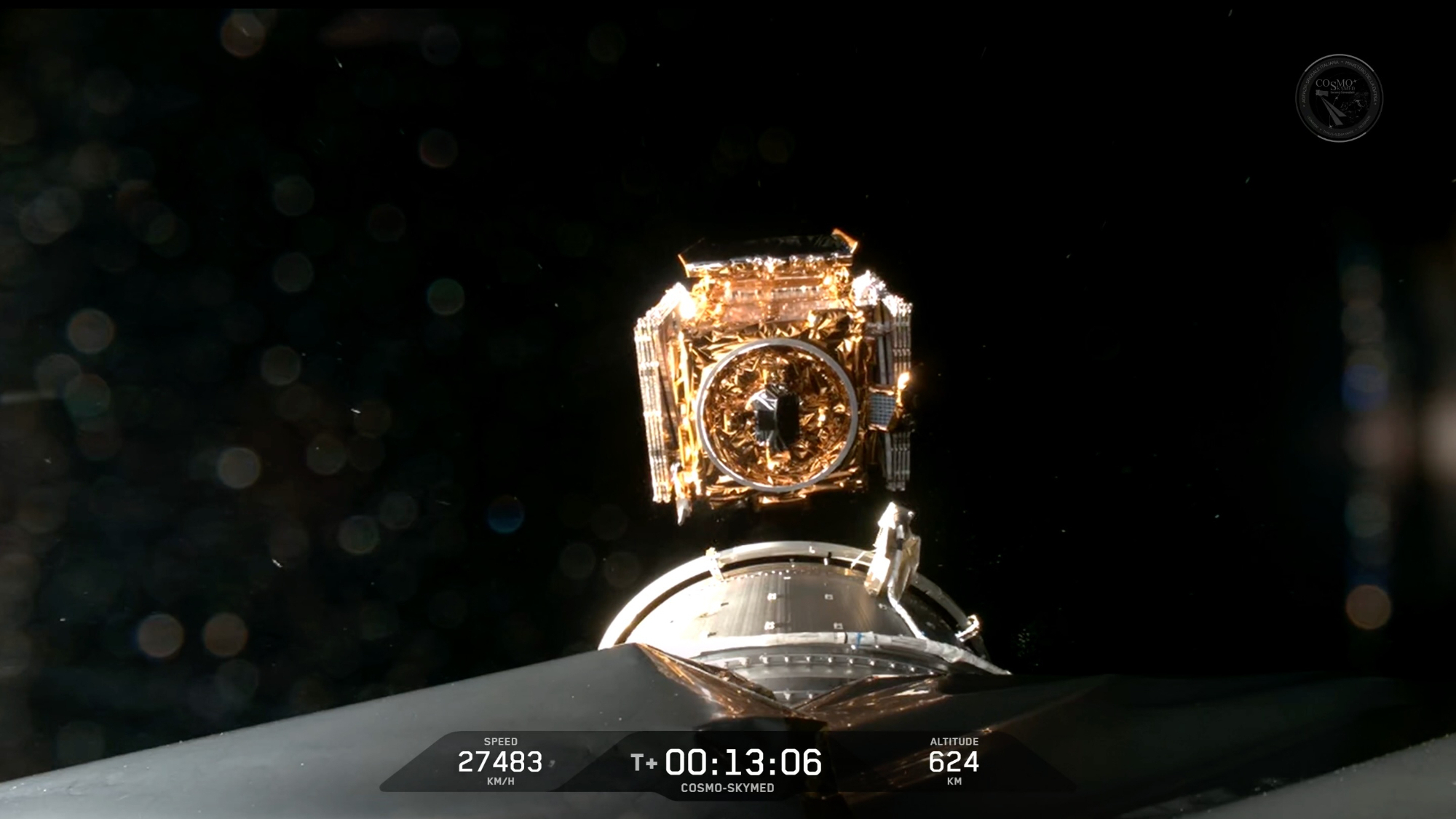 a boxy golden satellite deploys into earth orbit from a rocket's upper stage
