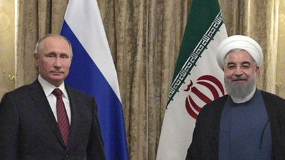 Russian President Vladimir Putin with Iranian President Hassan Rouhani in Tehran last year