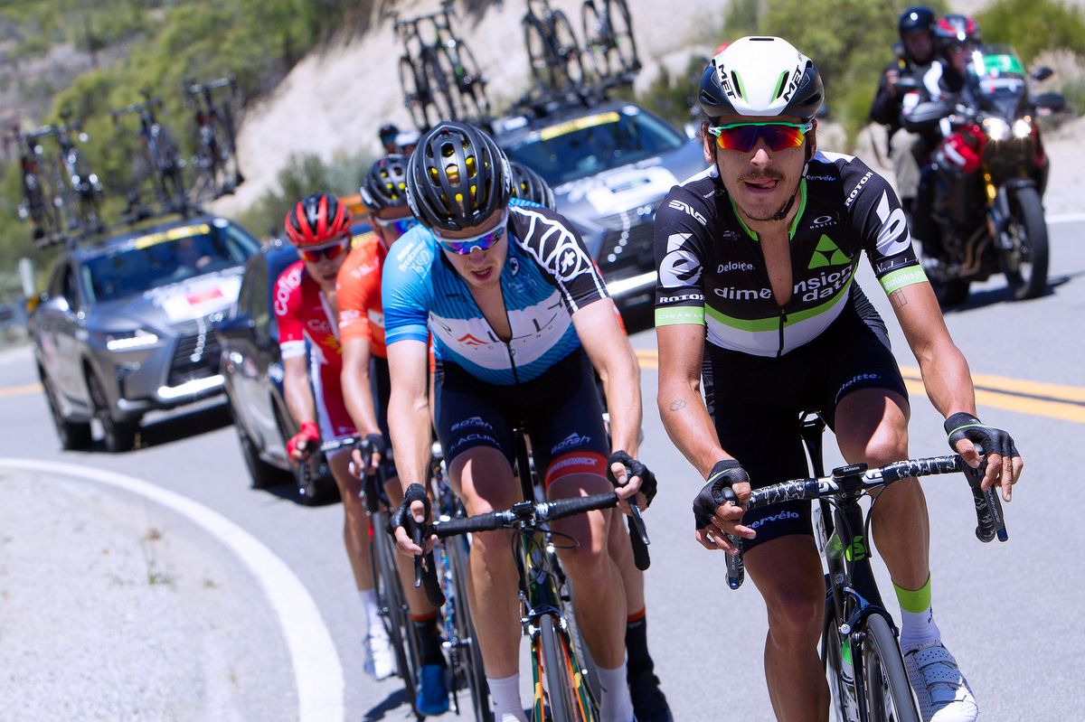 Lachlan Morton riding the breakaway to win back the best young rider jersey