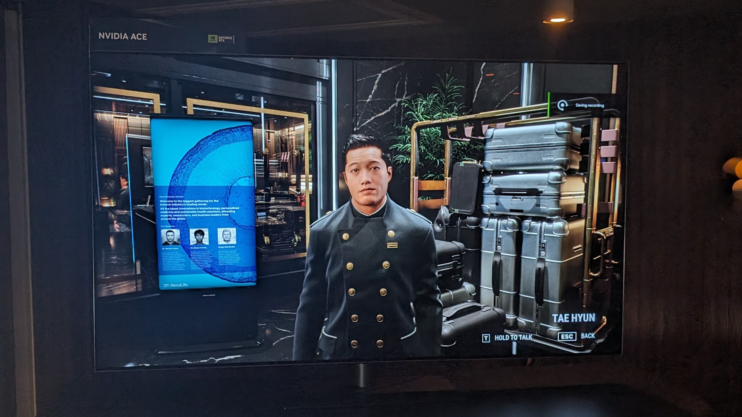 A photograph of a large TV displaying the Nvidia ACE 'Covert Protocol' demo.