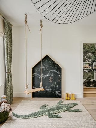 A small playroom with a swing