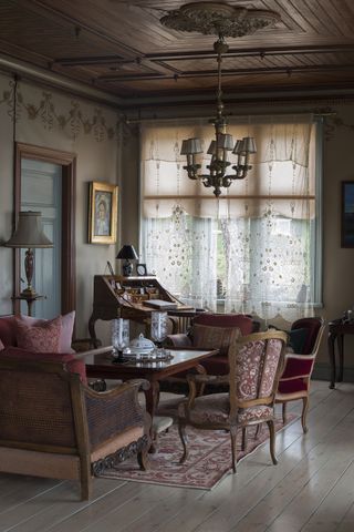 salon with antique furniture in a Swedish traditional summer home on an island