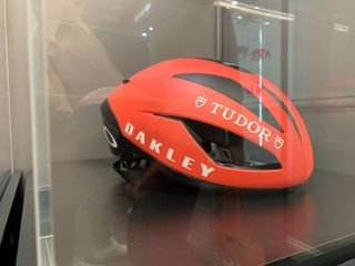 New Oakley Helmets in red pictured in glass case