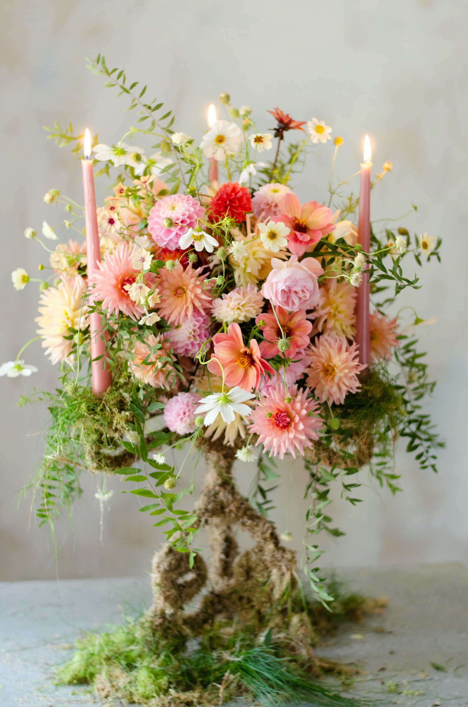 moss covered candelabra flower display