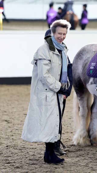Princess Anne, Princess Royal smiles as she presents an President award in the Indoor Arena during the opening of the Reaseheath Equestrian College on January 30, 2024