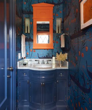 narrow bathroom ideas, blue and orange bathroom with orange accents, blue and orange wallpaper