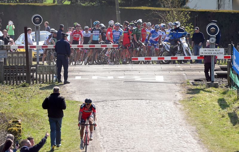 Some riders opted to wait for the train to pass before crossing the tracks
