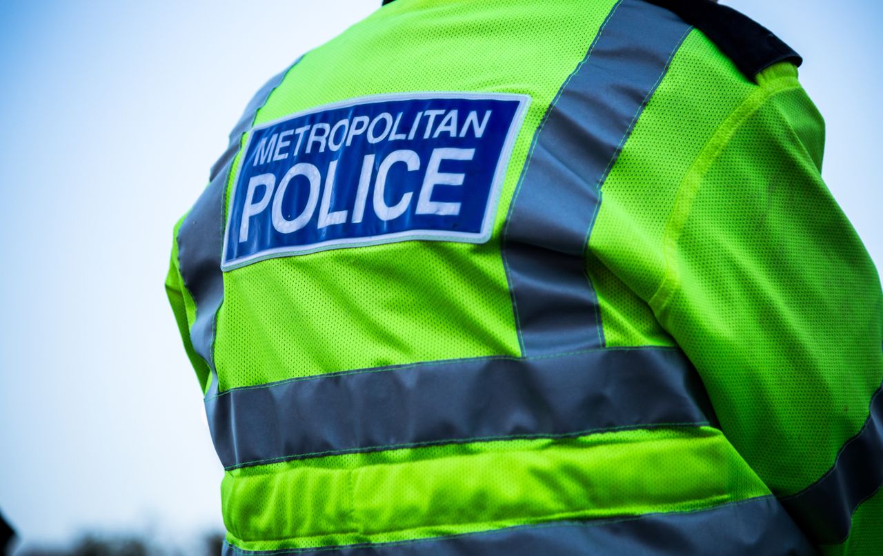 Rear image of a Metropolitan Police officer&#039;s hi-vis jacket