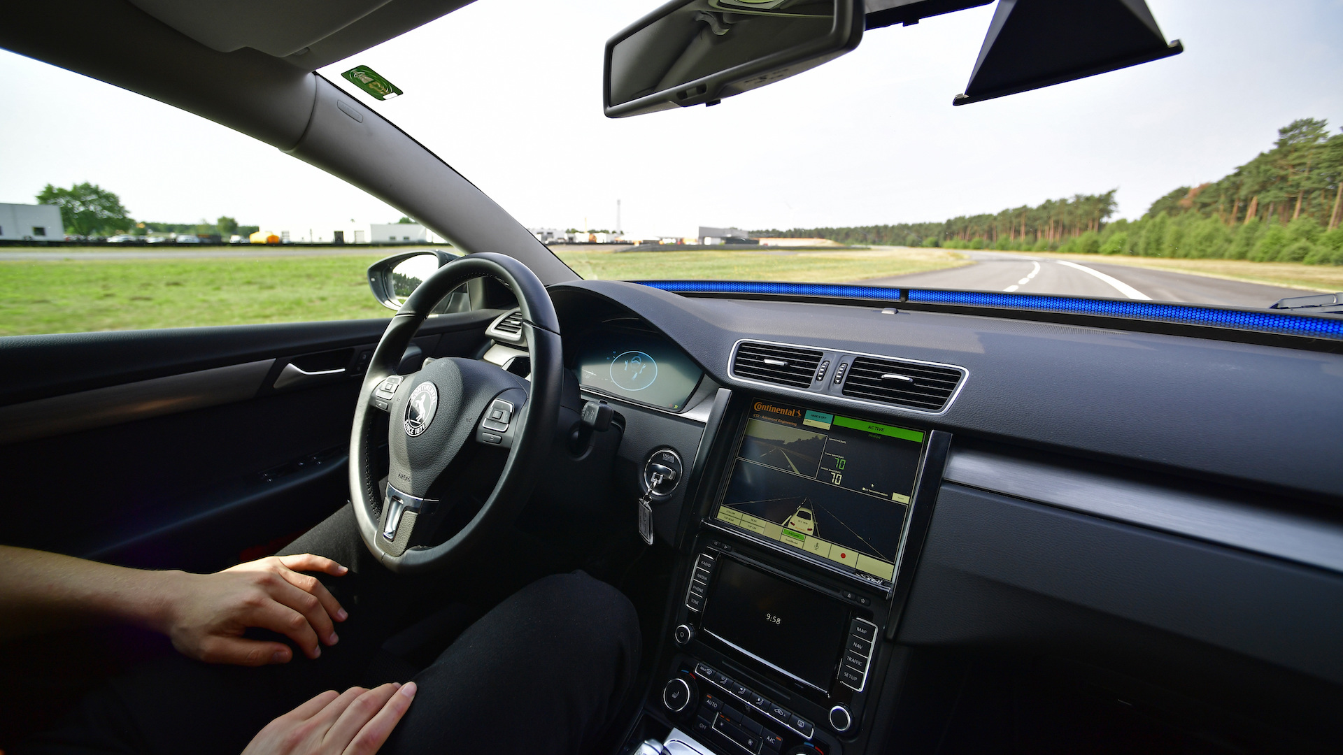 A person sitting in a self-driving car