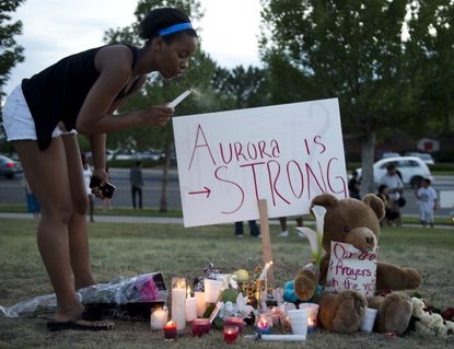 Mourner at an Aurora vigil.