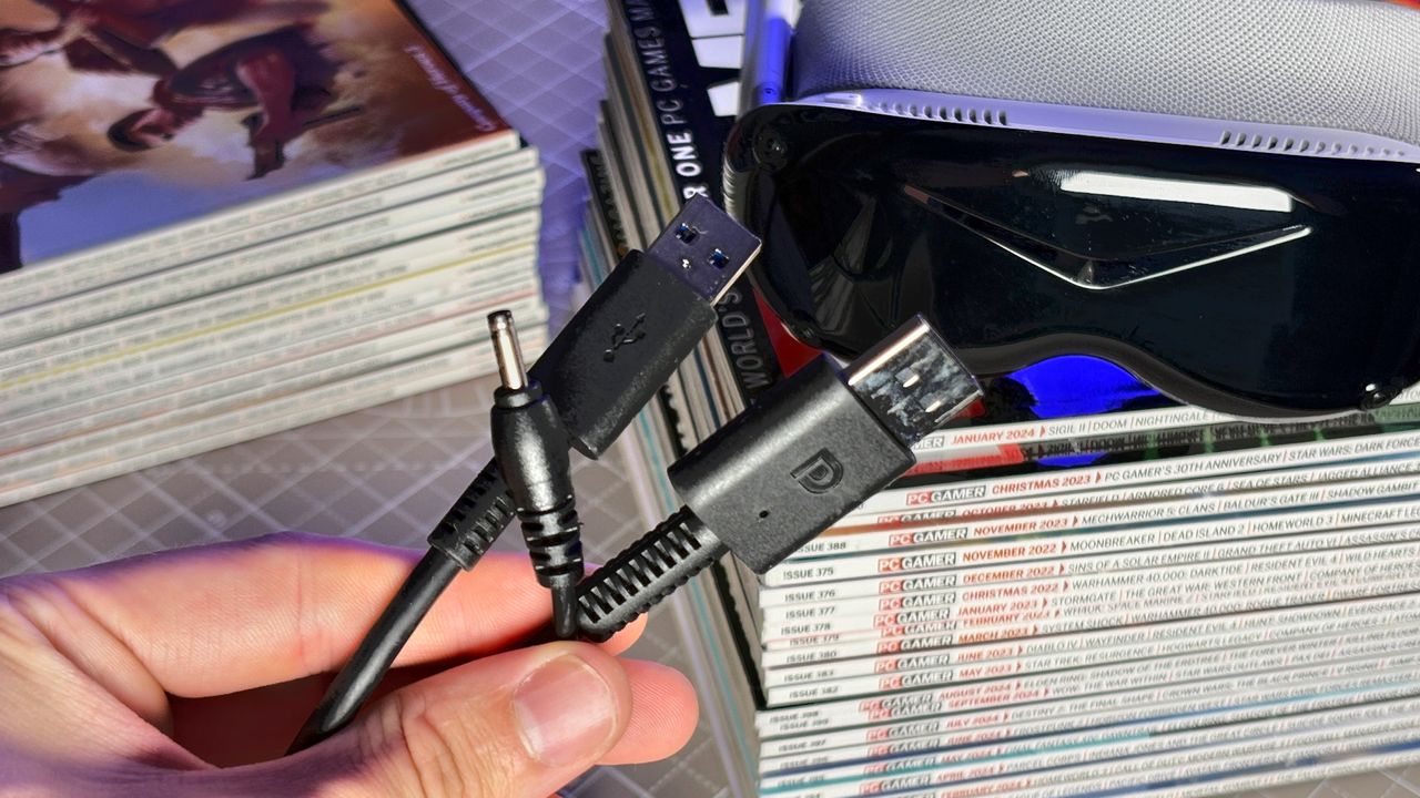 The Pimax Dream Air in white on a stack of PC Gamer magazine.