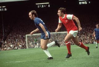 Chelsea's John Dempsey and Arsenal's John Radford chase after the ball during a match at Highbury in 1971.