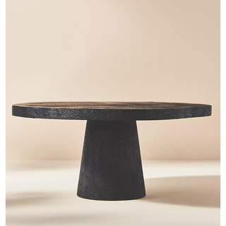 black wooden cake stand in a minimalist style