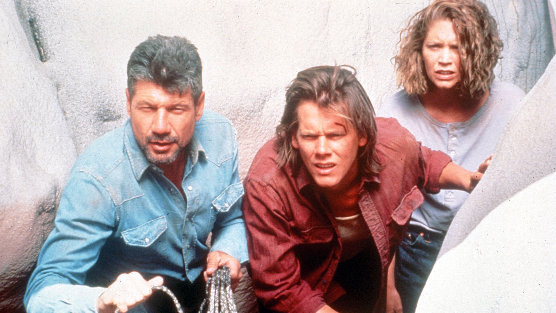 L-R: Fred Ward, Kevin Bacon and Finn Carter in a scene from &quot;Tremors&quot;