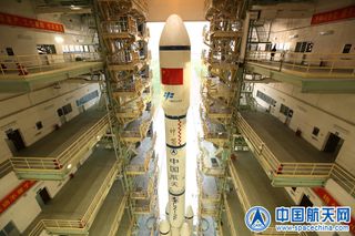 A Chinese Long March 2F rocket rolls out to its launch pad at the Jiuquan Satellite Launch Center in northwest China to launch the Tiangong-2 space laboratory.