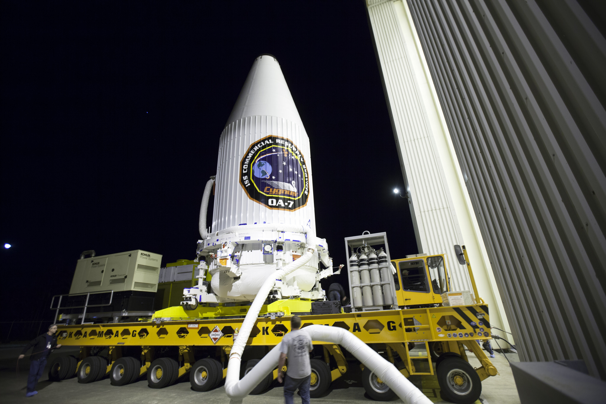 The Orbital ATK Cygnus spacecraft to launch NASA cargo on the OA-7 mission is seen here, inside its protective payload fairing, en route to be mated to its Atlas V rocket ahead of its launch from Cape Canaveral Air Force Station in Florida.