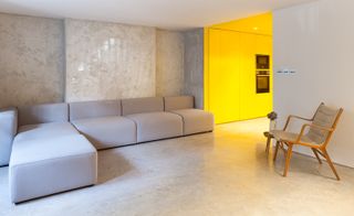 Living room into a yellow stairway